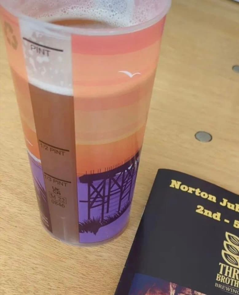 Custom branded festival cups in use at a stadium bar