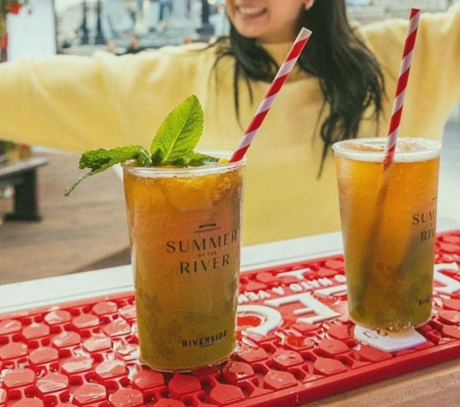 Compliant UKCA-marked cups being served at a busy licensed bar